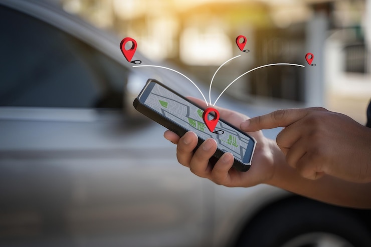 A man makes use of GPS and the internet online map in the car controls the navigator for GPS tracking