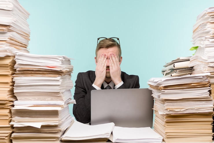 Man between paperwork