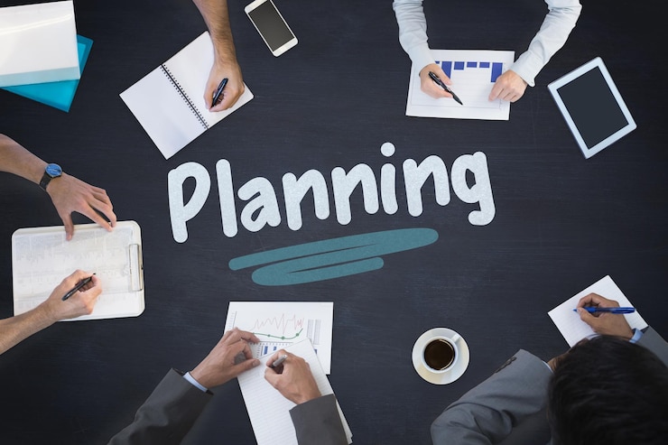 The word planning and business meeting against blackboard